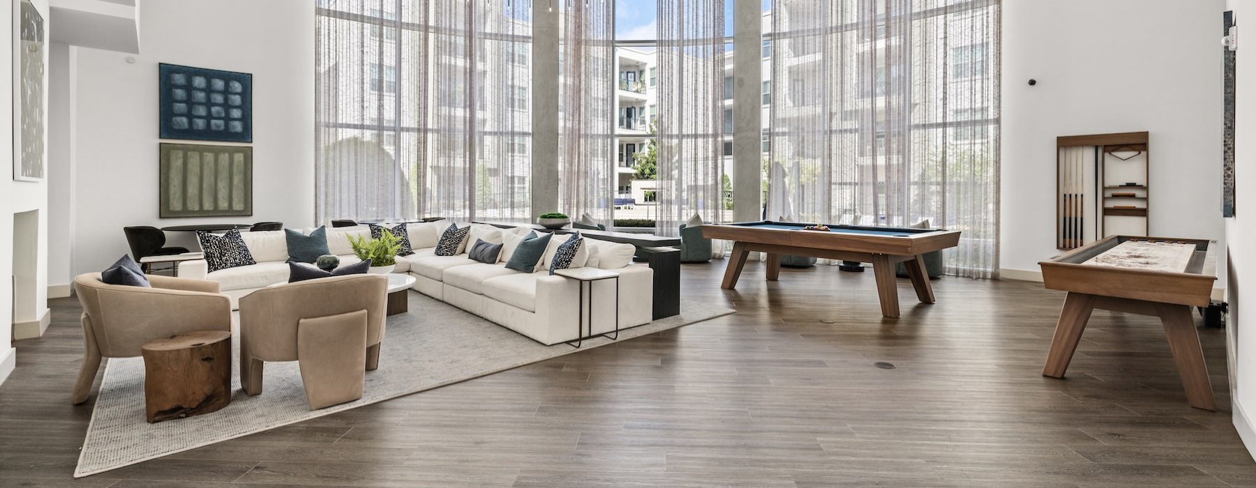 a clubroom with couches, tables and chairs